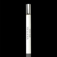 White cylindrical lip balm tube with silver cap and "Your Turn Billie Eilish" branding on black background.